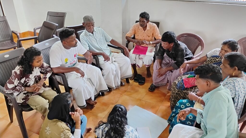 The Oorukoottam committees engage in discussions in different groups.