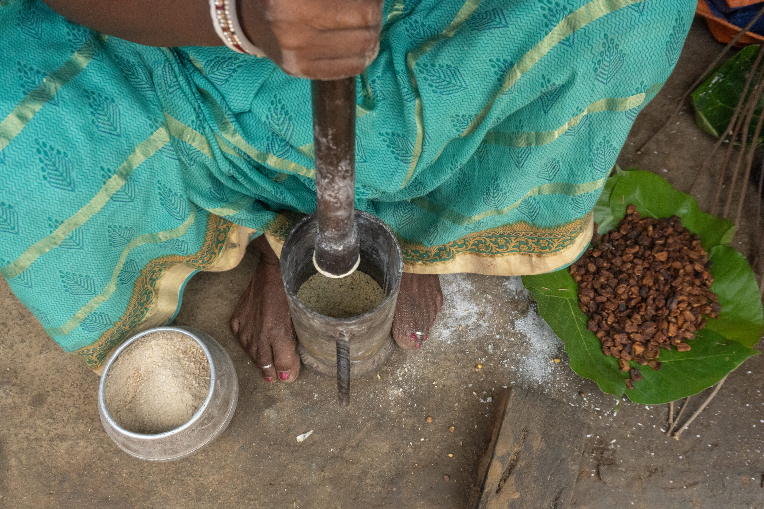 flaxseeds being pounded together to make Matkom Lathe