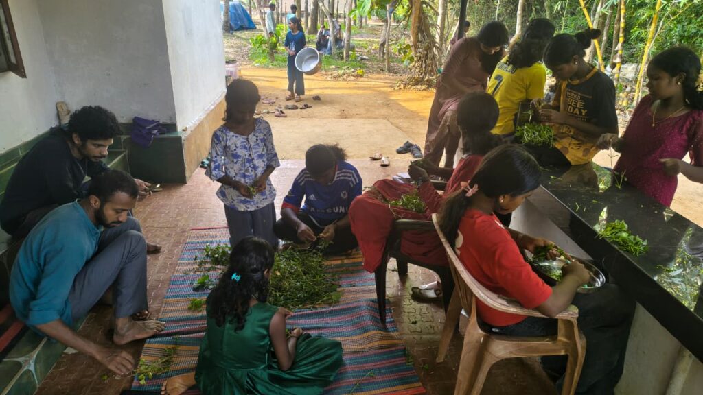 Camp participants preparing traditional food together