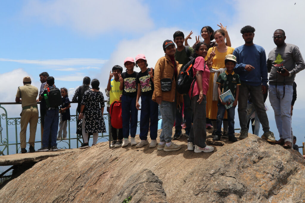 Students enjoying panoramic views at Kodanad View Point