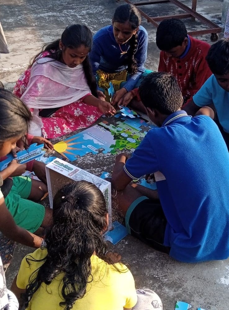Students from Krishnapudur doing puzzle activity