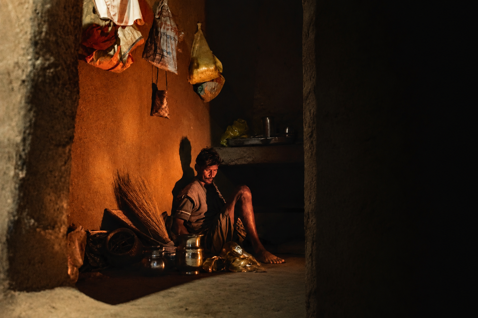 A older man sit in the traditional home