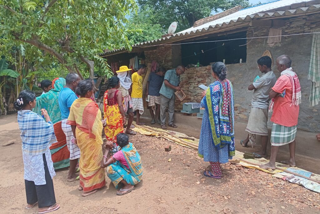 Manoj Das providing practical training on Bee box management in Patkita village