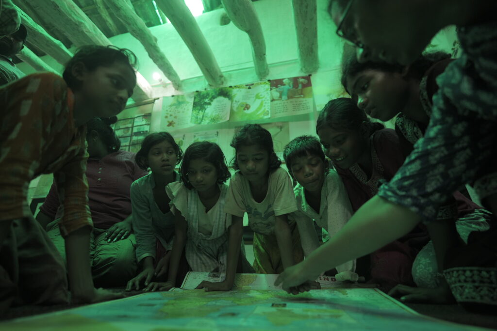 Students searching the diffrent places in tha map